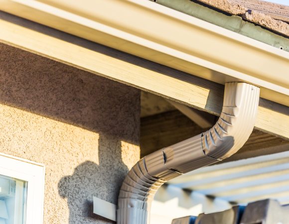 House with New Seamless Aluminum Rain Gutters.